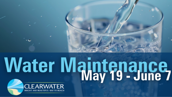 Water being poured into glass with blue background