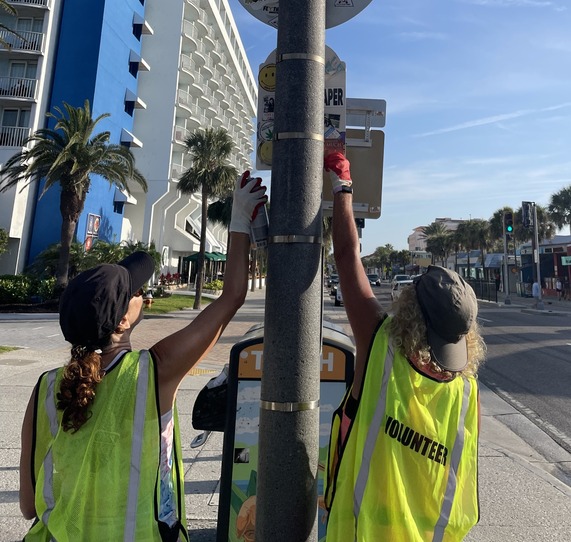 volunteer sticker removal