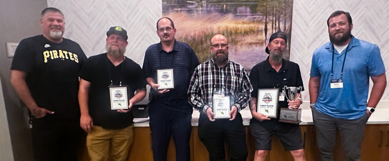 solid waste workers pose for group photo