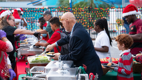 people at the holly jolly block party