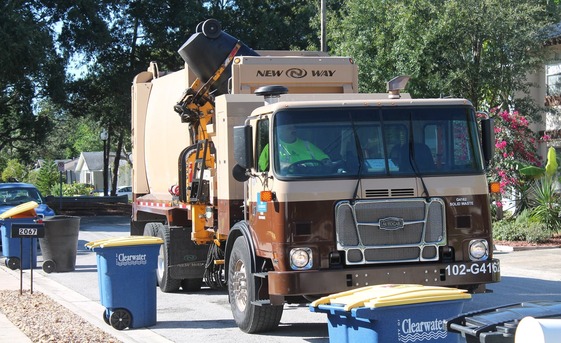 City trash truck picking up