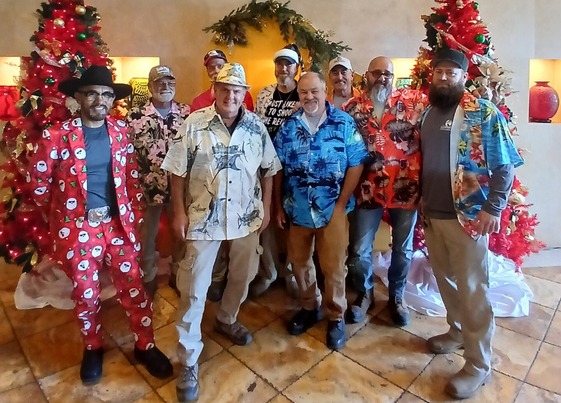 Employees dressed in tropical attire for holiday lunch
