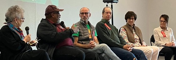 Building Better Neighborhoods conference with multiple people sitting together