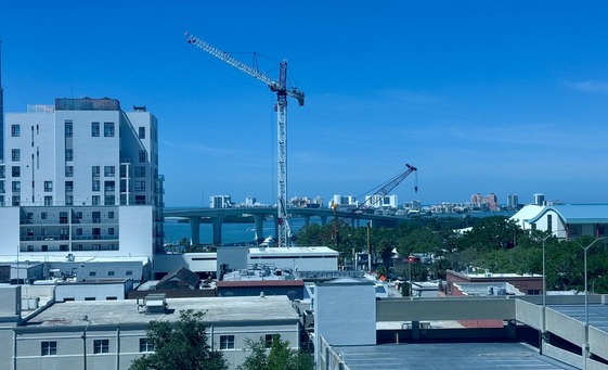This is an image of buildings and cranes in downtown Clearwater