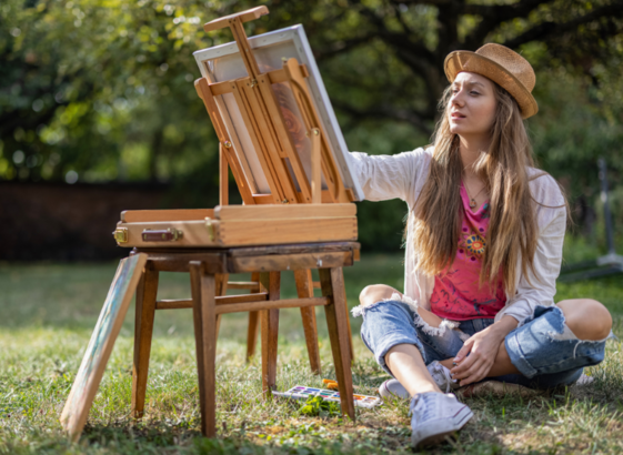 Photo of a girl outside drawing