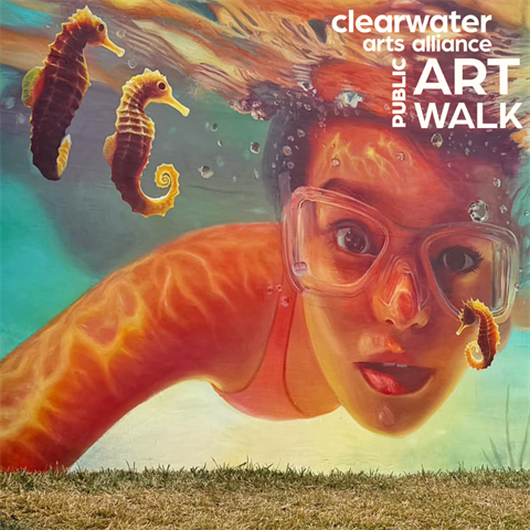 Image of a mural depicting a child swimming underwater with sea horses