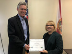 Park Service Director Eric Draper presents certificate of appreciation to Pat Steed