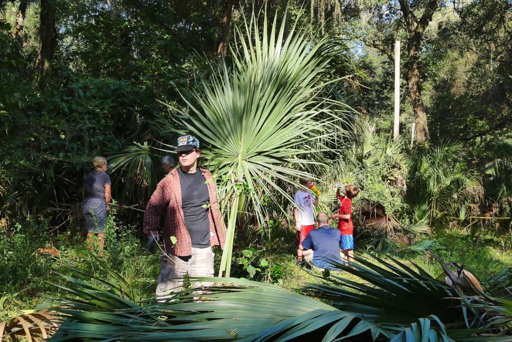 A group helping to clear an area for the Serenity Garden
