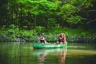 Two young people canoe in Florida Caverns State Park, FDEP