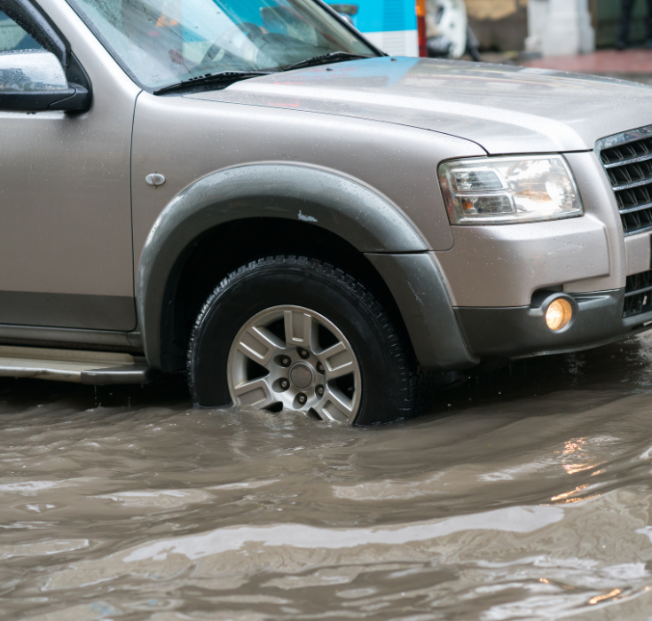 car driving in flood street