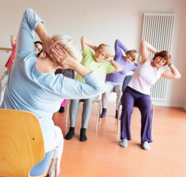 exercise seniors stretching in chair