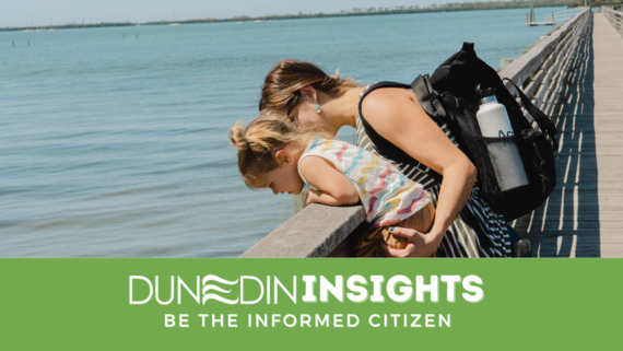 Photo of mom and daughter looking at water