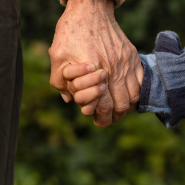 Holding a senior's hand