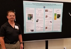 Dr. Dave Karlen pictured in front a water monitoring display.