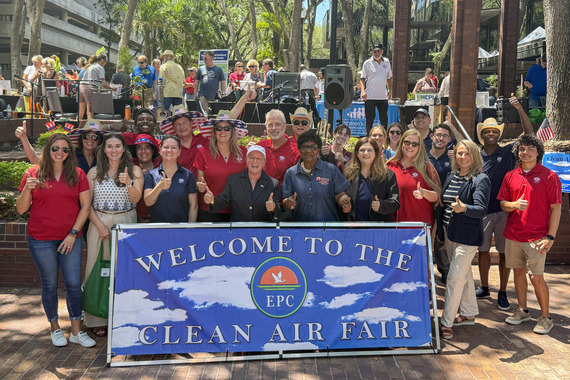 CAF group with banner