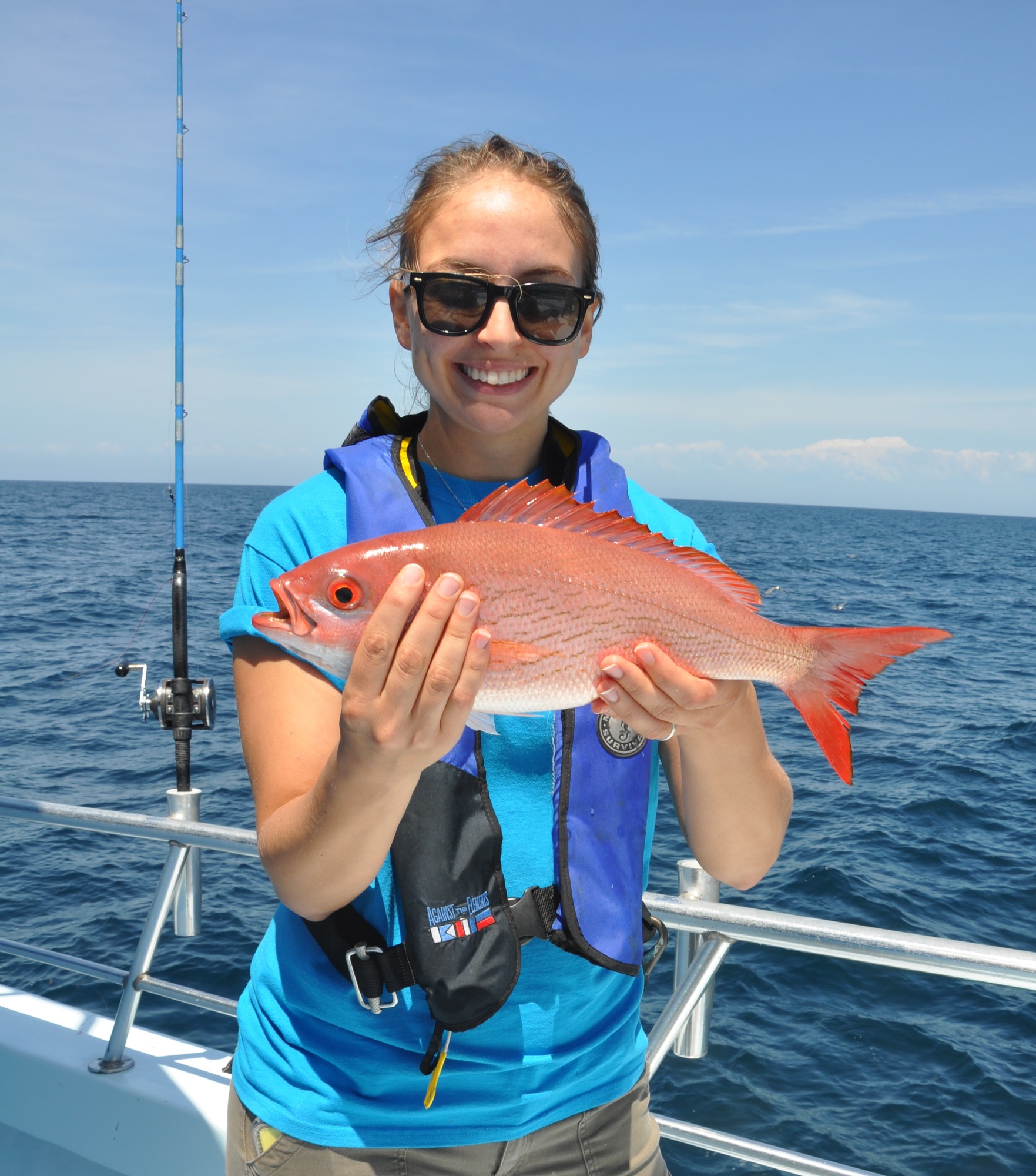 Angler holding reef fish