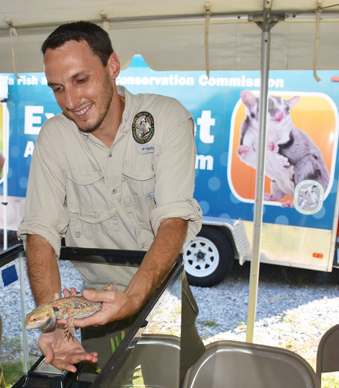 FWC staff with lizard