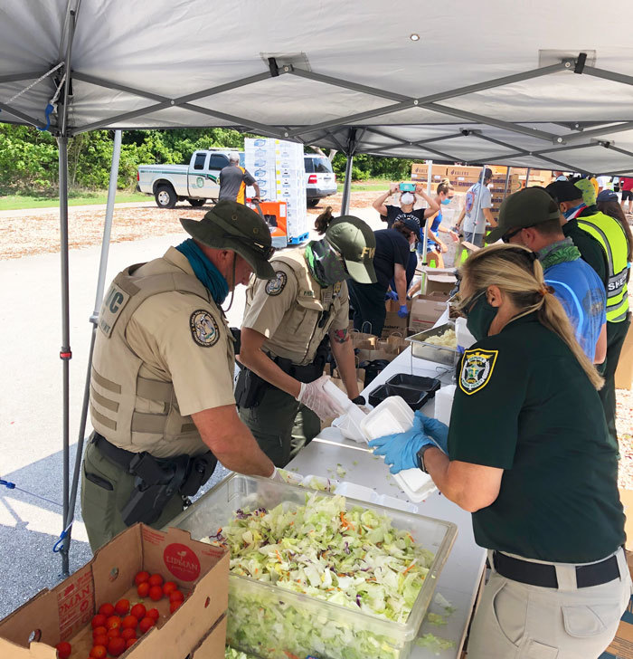 Officer Dube talking with Congresswoman Debbie Mucarsel- Powell