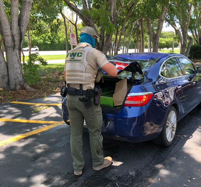 Officer Dube talking with Congresswoman Debbie Mucarsel- Powell