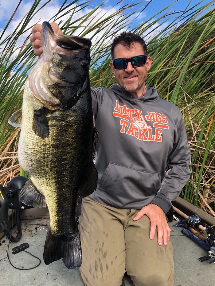 Angler holding big largemouth bass