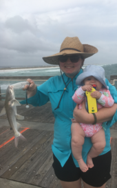 Mother and child with catfish