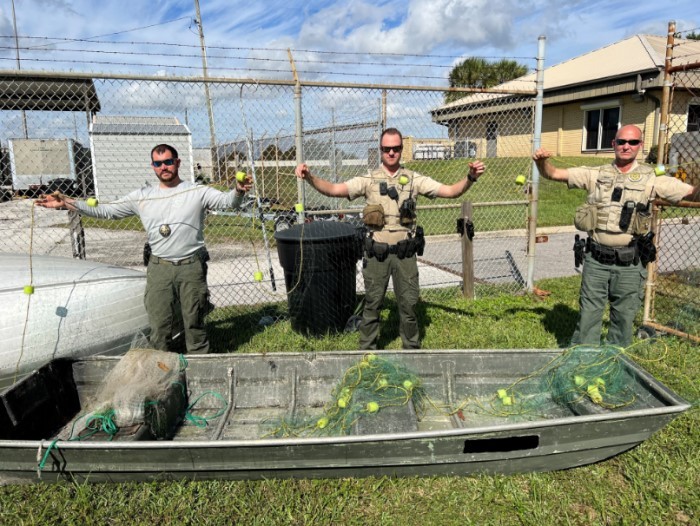 officers with gill net