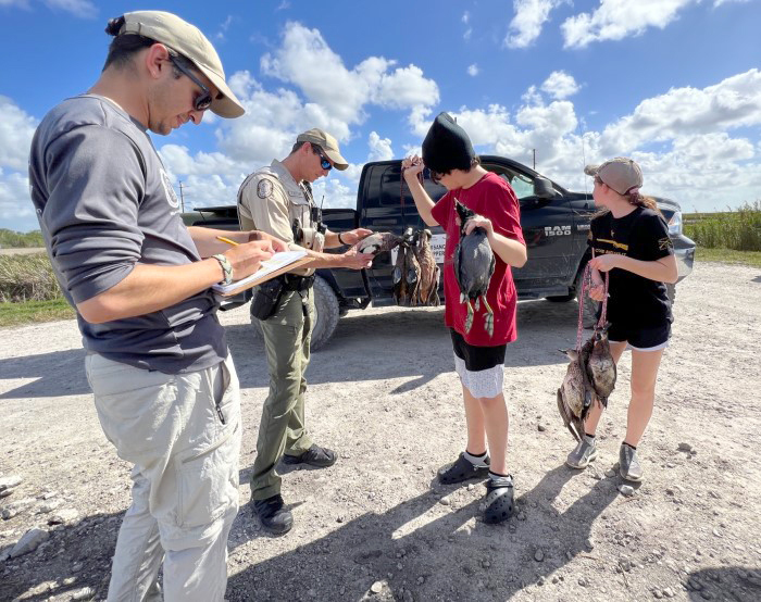 staff assist youth hunters