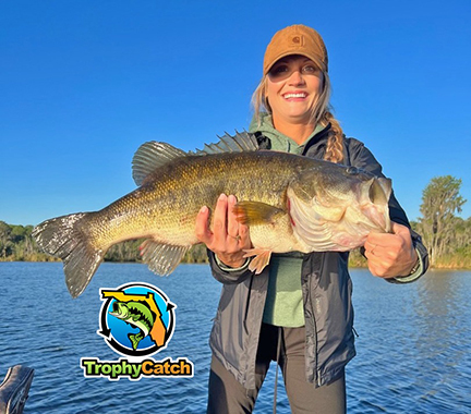 Angler with trophy Florida bass and TrophyCatch logo