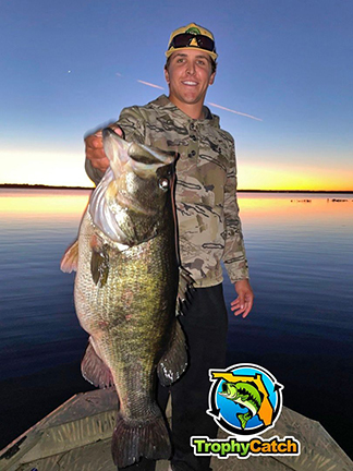 Angler with trophy Florida bass and TrophyCatch logo