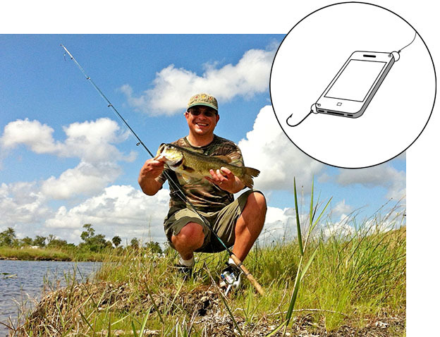 Angler with bass and smartphone