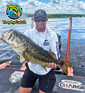 Angler Bobby Lane with trophy bass, TrophyCatch logo