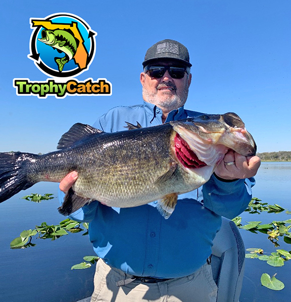 Angler with trophy Florida bass, TrophyCatch logo