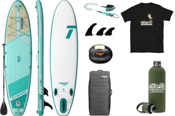 A paddle board and accessories alongside a WildQuest t-shirt and water bottle.