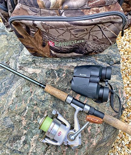 Binoculars, rod, and tackle bag