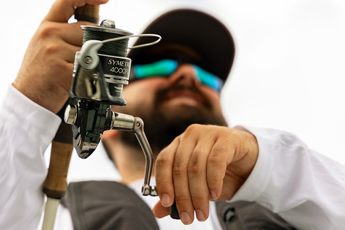 closeup of an angler with rod and reel