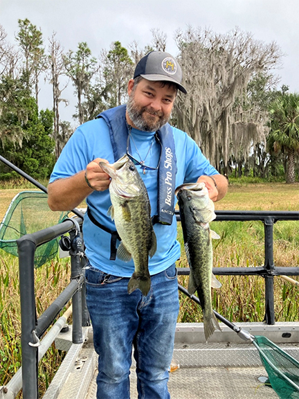 County staff with largemouth bass