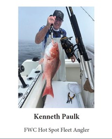 Angler Kenneth Paulk holding a red snapper. 