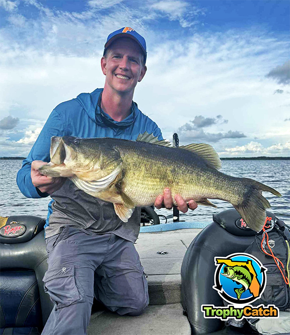 Angler with trophy Florida bass, TrophyCatch logo