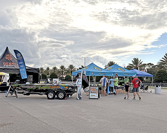 Phoenix bass boat, TrophyCatch tents at Coke Zero 400 race