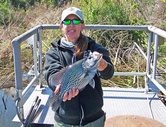 Biologist holding black crappie