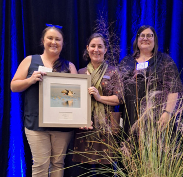 FSA partner holding Audubon award