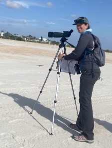 Photo of Yagen Gutierrez with scope on beach
