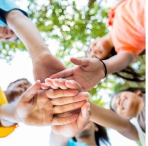 kids with hands stacked