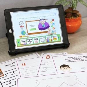 Miss Humblebee's Academy on tablet with printables on table