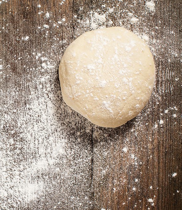 Pizza Dough on Floured Surface