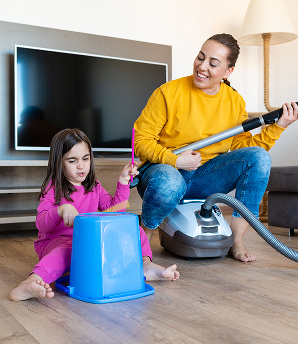 Mother and Daughter Making Music with Recycled Drums