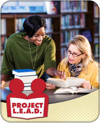 An image of a tutor teaching an older adult how to read