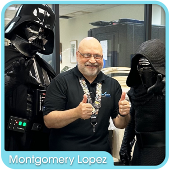 Montgomery Lopez posing with Darth Vader and Kylo Ren