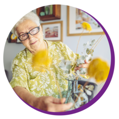 Older lady arranging flowers