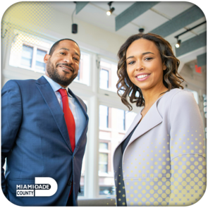 Two business professionals smiling for the camera